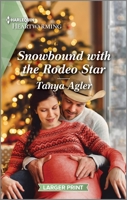 Snowbound with the Rodeo Star: A Clean and Uplifting Romance 1335475524 Book Cover