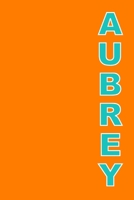 Aubrey: A 6x9 Lined Journal (Aubrey in aqua letters on an orange cover) 1677794461 Book Cover