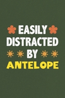 Easily Distracted By Antelope: Antelope Lovers Funny Gifts Dot Grid Journal Notebook 6x9 120 Pages 1679813528 Book Cover