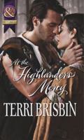 At the Highlander's Mercy 0373297343 Book Cover