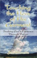 Touching the Hem of His Garment: Seeking God's Presence Through Prayer 1591290252 Book Cover