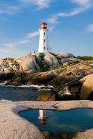 LIGHTHOUSE ROCK: A structure designed to emit light from a system of lamps and lenses and to serve as a navigational aid for maritime pilots at sea or on inland waterways. 1799050637 Book Cover