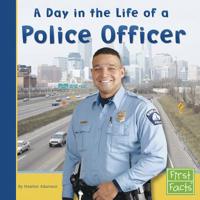 A Day in the Life of a Police Officer (First Facts: Community Helpers at Work) 0736846700 Book Cover