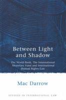 Between Light and Shadow: The World Bank, The International Monetary Fund and International Human Rights Law 1841135674 Book Cover