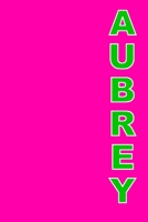 Aubrey: A 6x9 Lined Journal (Aubrey in green letters on hot pink cover) 1677791470 Book Cover