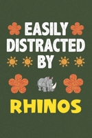 Easily Distracted By Rhinos: A Nice Gift Idea For Rhino Lovers Boy Girl Funny Birthday Gifts Journal Lined Notebook 6x9 120 Pages 1710195118 Book Cover